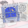 Coloring book titled 'Cute But Spooky' with Halloween-themed pages on a pink surface.